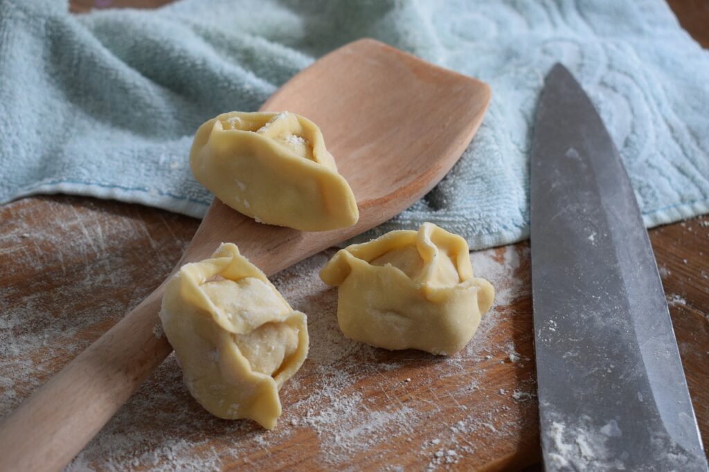 dough, food, knife, spoon, texture, towel, board, flour, edible, lunch, dinner, pelmeni, manti